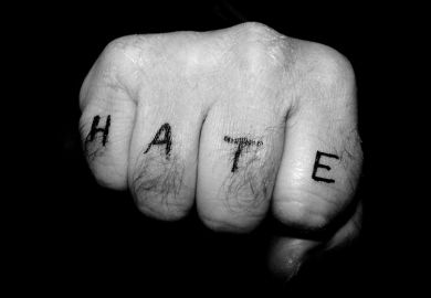 Fist with hate tattoo