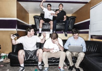 Five young men playing video games