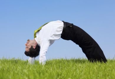 A flexible businessman A flexible businessman bends over backwards