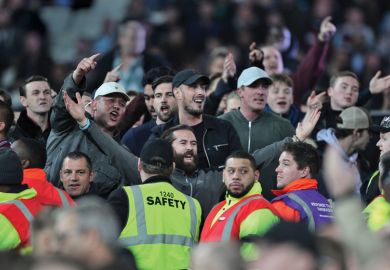 Football fans taunt fans of opposing side