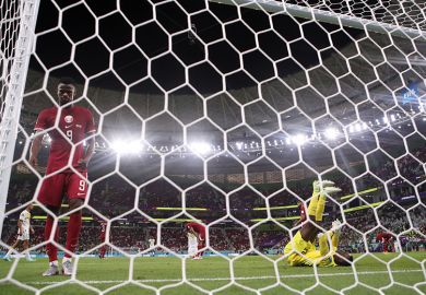 Mohammed Muntari and Meshaal Barsham of Qatar react during a FIFA World Cup Qatar 2022 match between Qatar and Senegal 