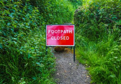 A footpath with a sign saying it is closed, illustrating restrictions on free speech