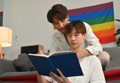 Gay students reading a book Gay students reading a book