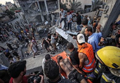An injured man is pulled from rubble in Gaza An injured man is pulled from rubble in Gaza