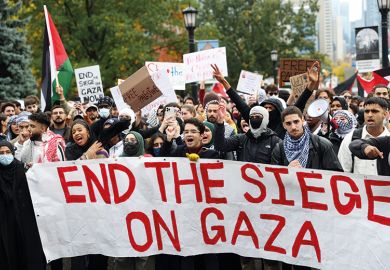 Protesters, mostly university students, gather to protest against Israeli airstrikes in Gaza, at Queen's Park outside the Legislative Assembly of Ontario in Toronto, Canada
