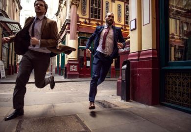 Businessmen in a rush in the city of London Businessmen in a rush in the city of London
