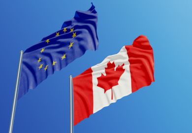 The Canadian and EU flags in the sky