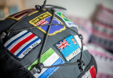 Close up of patches showing national flags sewn onto a backpack