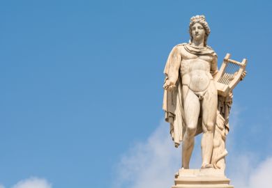  The statue of Apollo in Athens against the blue sky 