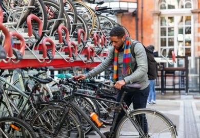 Student Parking His Bike In The City