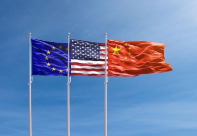 EU, US and China flags against the blue sky 