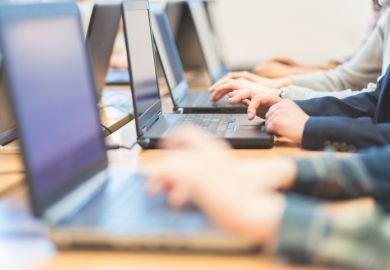 Group of women learning computer programming