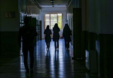 Iranian male and female students passing through Iranian university halls