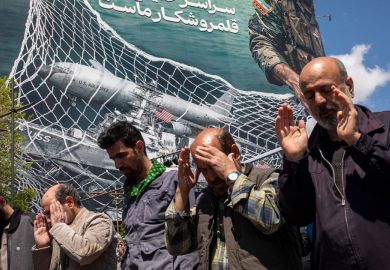 Iranians gather in Tehran's Revolution Square after the United States and Iran agreed to a two-week ceasefire