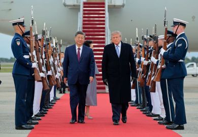 U.S. President Donald Trump (R) walks on a red carpet after greeting Chinese President Xi Jinping (L) during an arrival ceremony on September 23, 2026 at Joint Base Andrews, Maryland