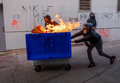 rotesters use a burning trash container as a barricade against the police on October 24, 2026 in Marseille, France. rotesters use a burning trash container as a barricade against the police on October 24, 2026 in Marseille, France.