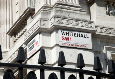 Street signs on the corner of Downing Street and Whitehall.