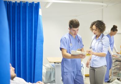  Male and female doctors on the hospital ward