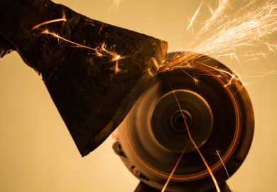 Close-up of axe sharpening