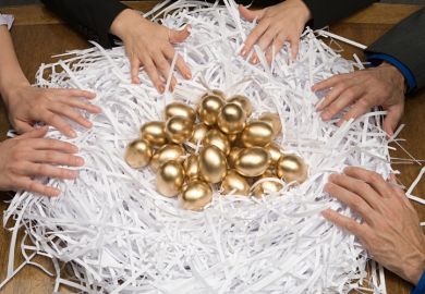 Colleagues around a nest of gold eggs