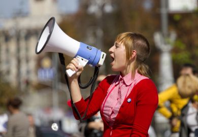 Girl shouts in a megaphone