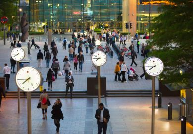 Canary Wharf business life. Business people leaving offices and going home after working day