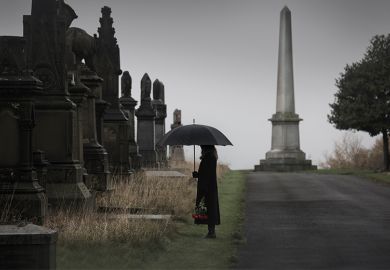 Woman looking at graves