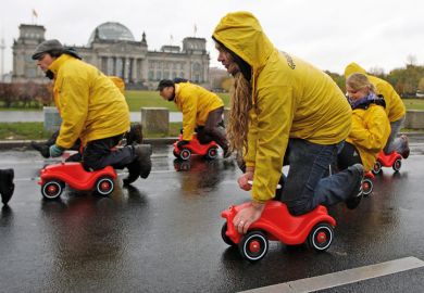 Greenpeace activists protesting, Reichstag building, Berlin Greenpeace activists protesting, Reichstag building, Berlin