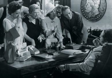 Group of people complaining at desk