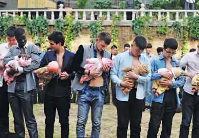 Group of men learning about breastfeeding