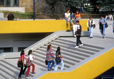 Students walking up stairs on campus Students walking up stairs on campus