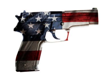 A gun with the colours of the US flag A gun with the colours of the US flag