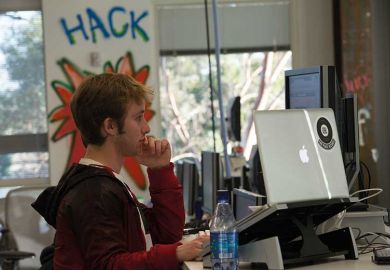 hacker-using-two-screens