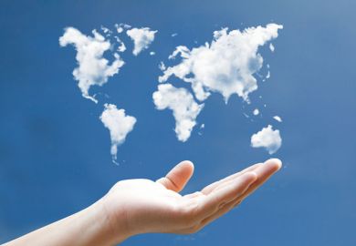 Hand holding world map drawn in clouds Hand holding world map drawn in clouds