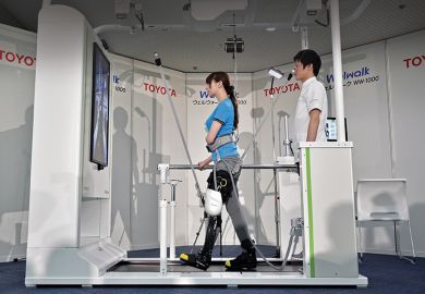 A model demonstrates how the rehabilitation-assist robot Welwalk WW-1000, developed by Japan’s Toyota Motor Corporation