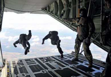 High-altitude, low-opening (HALO) paratroopers jumping from aircraft High-altitude, low-opening (HALO) paratroopers jumping from aircraft