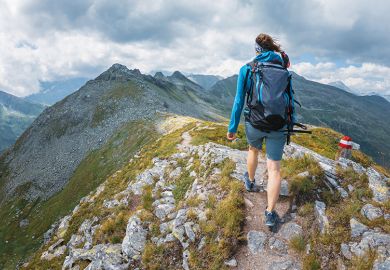 woman hiking to illustrate taking time out woman hiking to illustrate taking time out