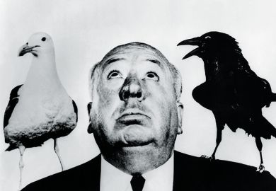Alfred Hitchcock with seagull and crow on his shoulders