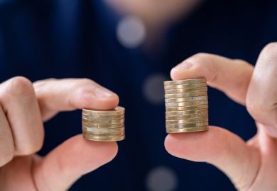 Holding two coin stacks Holding Two Coin Stacks