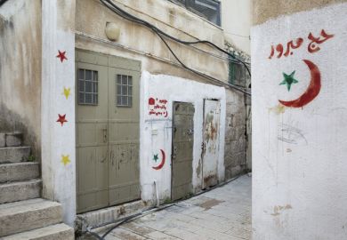 Horizontal view of some Arabic graffiti on the Muslim Quarter streets of the Old City of Jerusalem