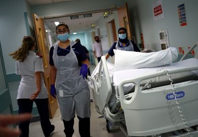 Medical staff transfer a patient through a corridor at The Royal Blackburn Teaching Hospital in East Lancashire. To illustrate that the UK’s incoming tax on international student fees could have unintended consequences for country’s health system. Medical staff transfer a patient through a corridor at The Royal Blackburn Teaching Hospital in East Lancashire. To illustrate that the UK’s incoming tax on international student fees could have unintended consequences for country’s health system.