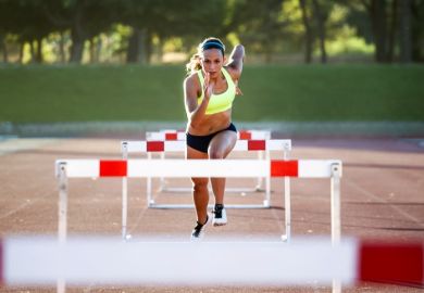 A woman jumping hurdles, illustrating meeting learning outcomes