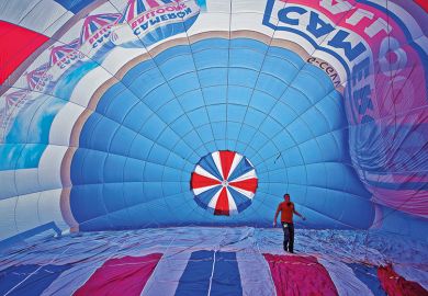 Man inside a hot air balloon to suggest reversing higher education expansion in England