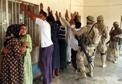 Iraqi family stand detained by US Marines