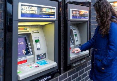Young Adult Woman withdrew cash from ATM machine