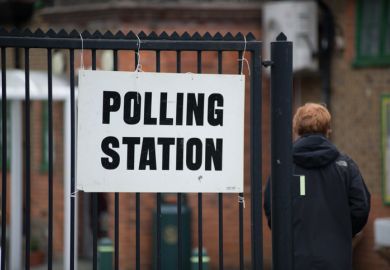Someone walks into a polling station 