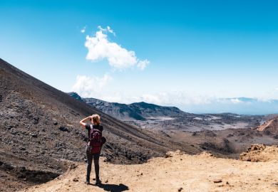 New Zealand, North Island, People enjoying the beautiful Landscape view of Tongariro Crossing track on a beautiful day with blue sky