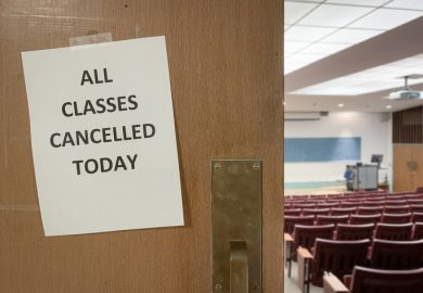 Close-Up of a Notice on a Door to an Empty Classroom that Reads "All Classes Cancelled Today" Close-Up of a Notice on a Door to an Empty Classroom that Reads "All Classes Cancelled Today"
