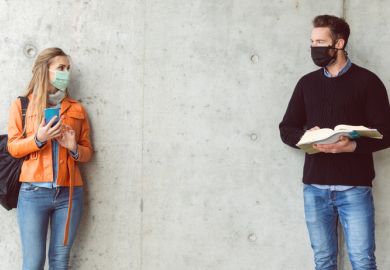 Students socially distancing with face masks