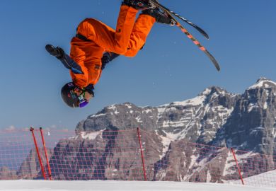 Freestyle skier flips upside down